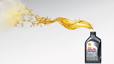 Sebastian Vettel et Kimi Raikkonen font le plein de voitures Ferrari à une station Shell